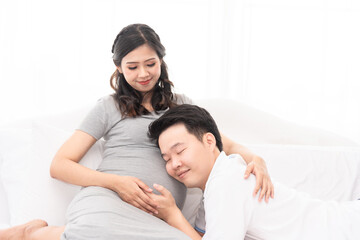 Asian new father spending time with his wife, excited dad expecting for newborn