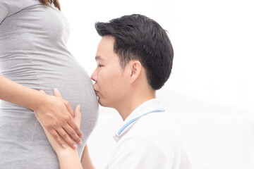 Asian new father spending time with his wife, excited dad expecting for newborn