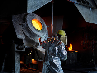 Blue-collar worker wearing protective workwear in steelmaking industry