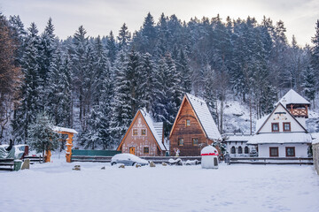 Dolny Kubin, Slovakia - December 26 2021: Traditional log houses, restaurant Koliba and...