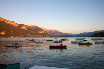 Sunset at the Lake with boats and mountains, Annecy, France