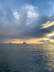 Naklejka na ściany i meble wonderful idyllic sunset at the sea, sea horizon with ships