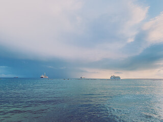 wonderful idyllic sunset at the sea, sea horizon with ships