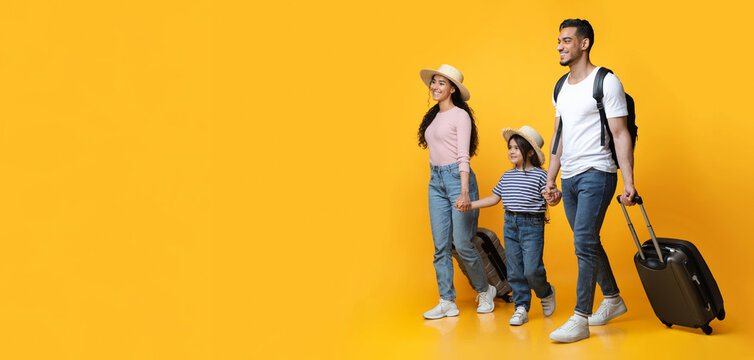 Happy Cheerful Middle Eastern Family Of Three With Suitcases Going On Vacation