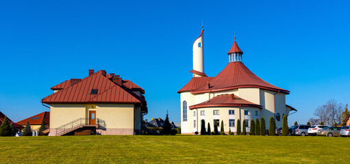 Modernistic Sanctuary of the Divine Mercy church and clergy house in Sedziszow of Podkarpacie region in Lesser Poland - obrazy, fototapety, plakaty