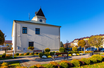 Historic Ratusz Town Hall building at Rynek Market Square in old town quarter of Sedziszow Malopolski town of Podkarpacie region in Lesser Poland - obrazy, fototapety, plakaty