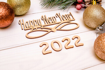 Happy new year 2022 on wooden white background
