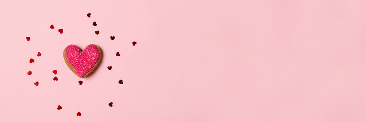 Beautiful banner with a gingerbread heart on a pink background with a place for text. Romantic Valentine's Day Card