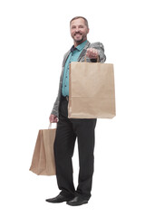 in full growth. happy man with shopping bags.