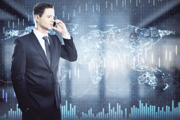 Attractive young european businessman talking on the phone with abstract big data map hologram in blurry office interior. Communication and network concept. Double exposure.