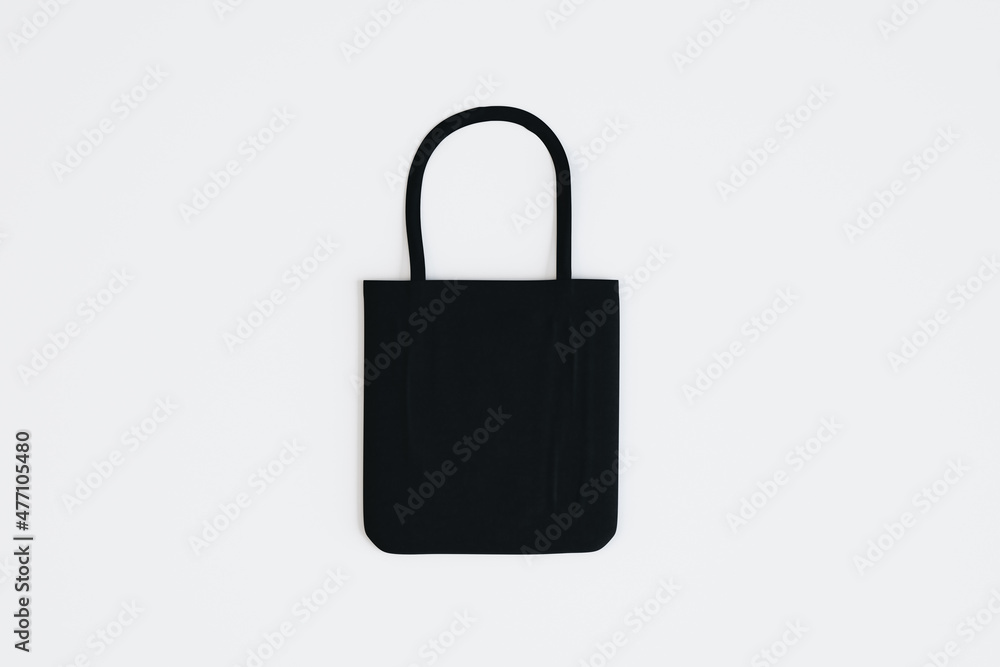Poster Top view and close up of empty black shopper on white background. Mock up, advertisement, 3D Rendering.