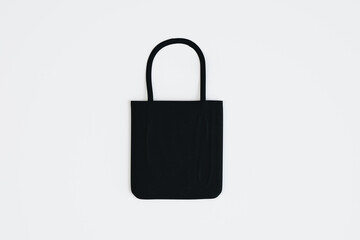 Top view and close up of empty black shopper on white background. Mock up, advertisement, 3D Rendering.