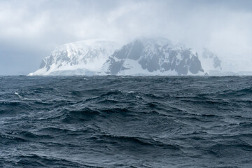 Antarctic waters with mountain in background
