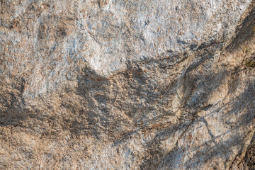 Detail of stone texture for background. Surface of the marble with brown tint
