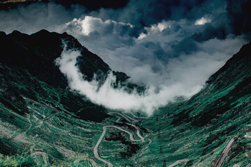 Fog covered mountain summer landscape in Transfagarasan, Romania