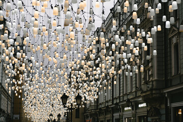 Obraz premium A beautiful street decorated with lanterns. Stoleshnikov Lane , Moscow