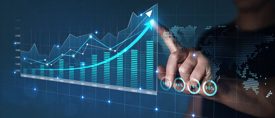 Businessman draws economic growth graph financial data.Stock market investment. Financial and...