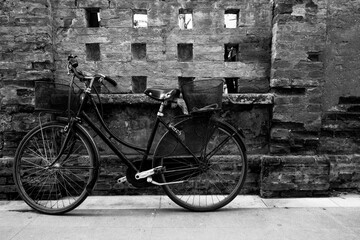 old bicycle in front of wall