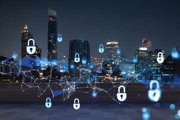 Rooftop with wooden terrace, Bangkok night skyline. Cyber security concept to protect clients confidential information. IT hologram padlock icons. City downtown. Double exposure.