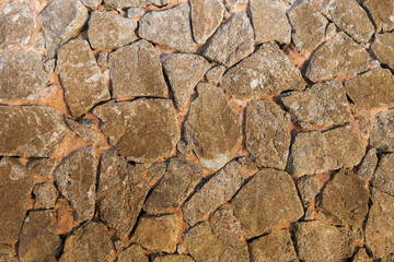 A walkway of several stones arranged in layers, or perhaps a wall with many cracks, can be used as a wallpaper for architecture and design projects, or for geological work.
