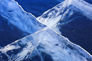 Fototapeta ice texture cracks baikal, abstract background winter ice transparent blue obraz