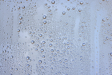 drops glass blue background abstract, transparent cold background water splashes