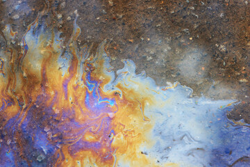 spilled gasoline rainbow background, industrial hazard spill pollution, abstract texture multicolored