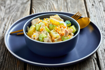 salad of chicken breast, corn, ananas, cucumber