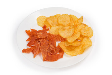 Dry chicken snacks and potato chips on a white dish