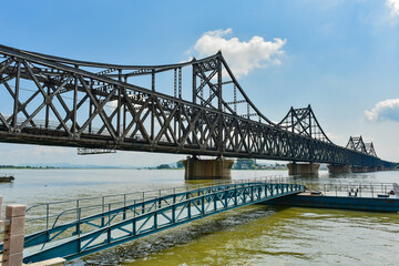 At the broken bridge site of Yalu River in Dandong, China, the Chinese on the plaque is translated into English: "broken bridge of Yalu River".