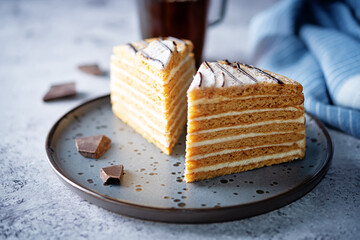 Honey cake with cream cheese filling decorated with chocolate