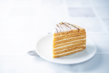 Honey cake with cream cheese filling decorated with chocolate
