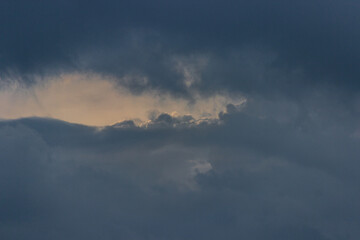 In the evening, the sky was very thick with many clouds. The clouds enclosed the sky as if there was a new world behind them, and the layers of clouds were spectacular.