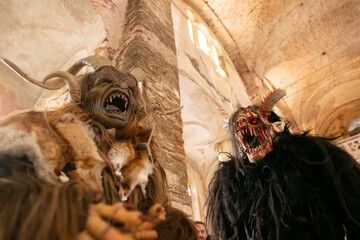 Krampus hell devils performers in traditional scary masks
