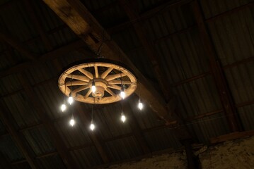 Barn wedding countryside old style vintage ceiling cart wheel light decoration