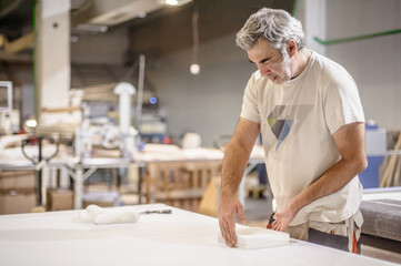 Logistic printing technician worker controls and arranges the printed material