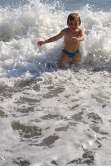 Fototapeta premium child running in the sea