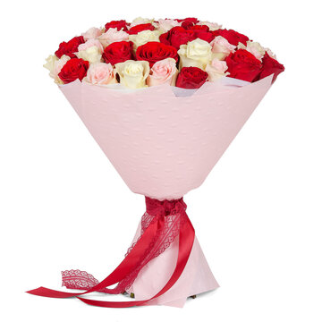 Bouquet of red and white roses in pink paper cone with ribbon isolated on white background