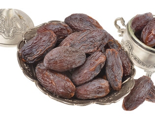 Beautiful bowl full of ripe  juicy dates,medjoul fruit, isolated on a white background.Food rich in antioxidants, superfruit rich in nutrients.