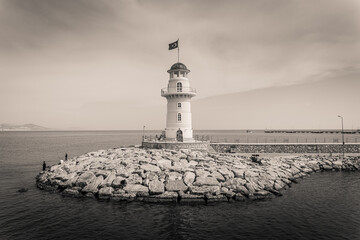 lighthouse alanya flag sea stones
