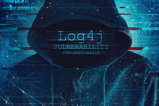 Hooded computer hacker in cybersecurity vulnerability Log4J concept