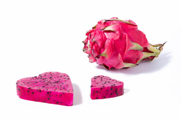 Piece of pitahaya fruit with pulp hearts on white background. Love for this exotic fruit