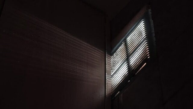 Contaminated ventilation in a dark room, through which light rays penetrate.