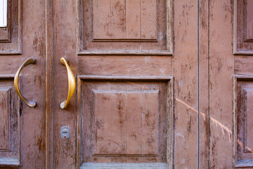 Old wooden exterior door. Antique door close-up