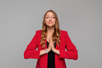 Coy young blonde woman begging for help, apologizing, say please with beg pray gesture, need...