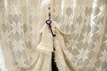 hand knitted curtains and amulets