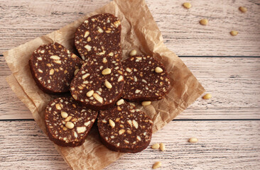 biscuit cake with pine nuts on a beige background