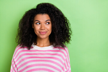 Fototapeta premium Photo of young pretty woman curious think look empty space minded isolated over green color background