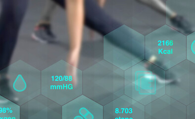 digital tracking of health data and fitness with legs of people doing sports workout in the...