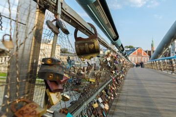 Bridge of lovers with hanging padlocks